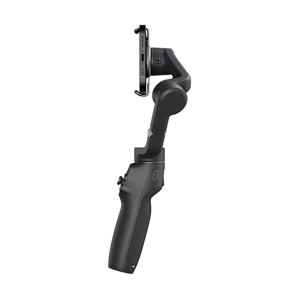 DJI_Osmo_Mobile_6_006 DJI Osmo Mobile 6 -gimbaali kännykälle on kuvattu pystyasennossa valkoista taustaa vasten, ja älypuhelin on kiinnitetty sen yläosaan.
