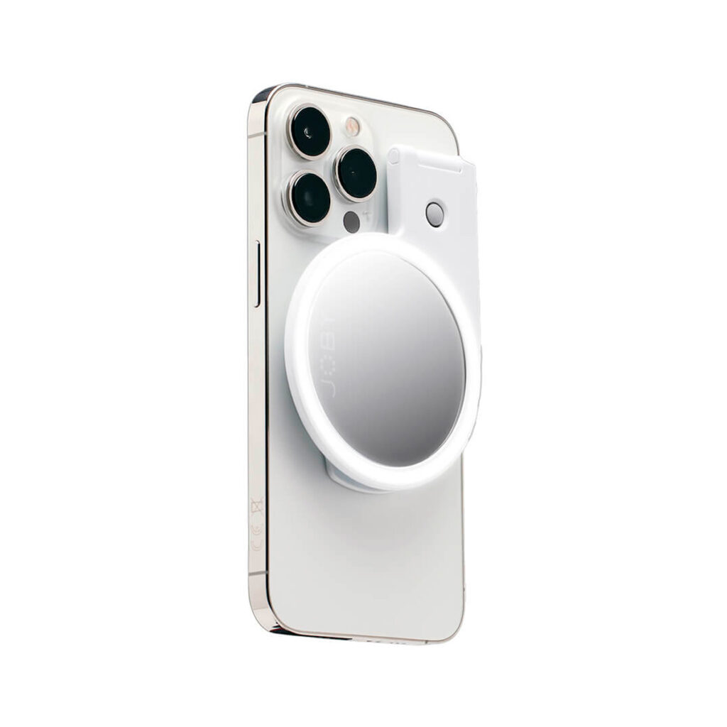Joby-Beamo-Ring-Light-for-MagSafe-white The white smartphone with three rear cameras has a Joby Beamo Ring Light for MagSafe - A white, round, removable light that can be attached to the back of the smartphone to illuminate the camera area.