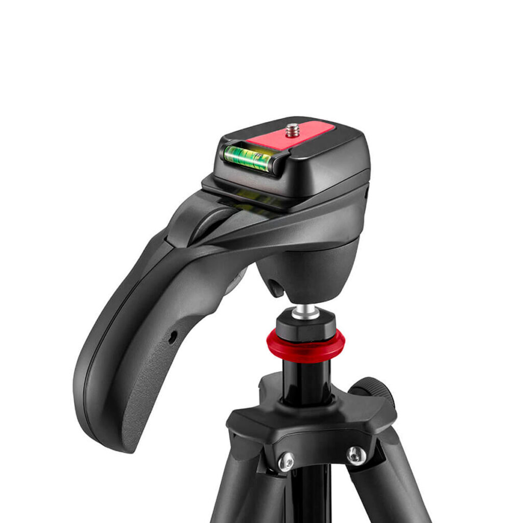 Joby-Compact-Action-3K-4 Close-up of the Joby Compact Action 3K tripod head, featuring a black design with red accents, a panning handle, a bubble level and a camera mounting screw attached to the top of the tripod legs.