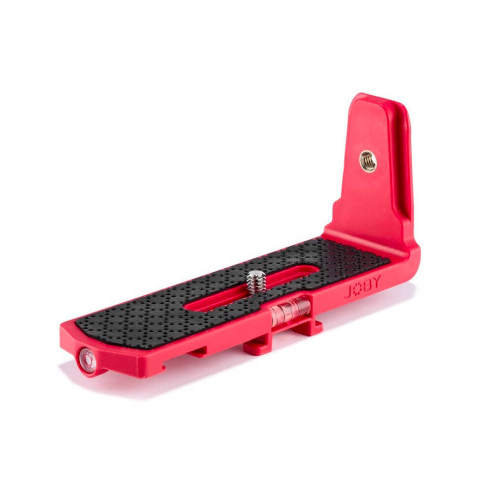 Joby-Vert-Vertical-L-Bracket-2 The Joby Vert Vertical L Bracket is a red, L-shaped camera bracket with a textured black mounting surface, a threaded screw for camera attachment and several holes for additional mounting options.