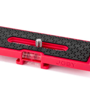 Joby-Vert-Vertical-L-Bracket-4 A close-up view of the Joby Vert Vertical L Bracket shows its red quick release plate, textured black surface, metal screw, bubble level and visible JOBY logo.