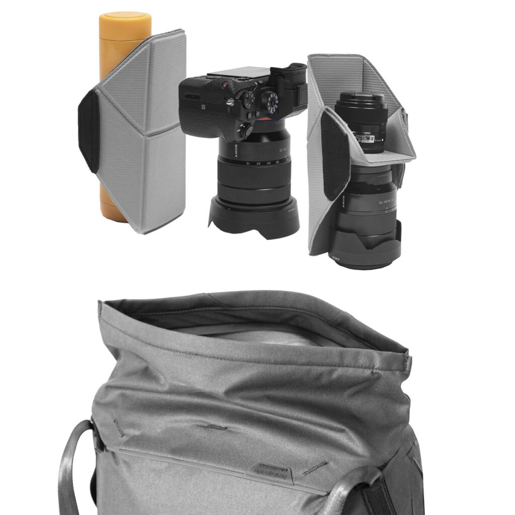 Peak-Design-Everyday-Tote-15l-black-3 Kolme harmaata pehmustettua kääreitä kiinnittää keltaisen pullon, kameran ja objektiivin sekä ylimääräisen objektiivin. Niiden alapuolella on Peak Design Everyday Tote 15L v2 -laukun tilava sisätila mustana.