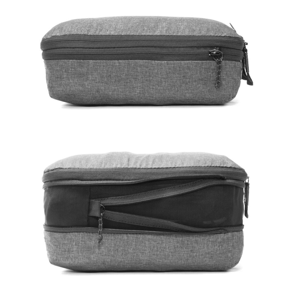 Peak-Design-Packing-Cube-medium--Charcoal3 Peak Design Packing Cube Medium in Charcoal näkyy ylhäältäpäin suljetulla vetoketjulla ja sivulta, jossa korostuu useita vetoketjullisia lokeroita ja organisatorisia osioita.