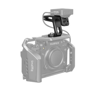 SmallRig-2756-2 SmallRig camera cage with Fujifilm X-T4 and SmallRig 2756 Mini Top Handle for Lightweight Cameras and an external device connected to the handle with a cable.
