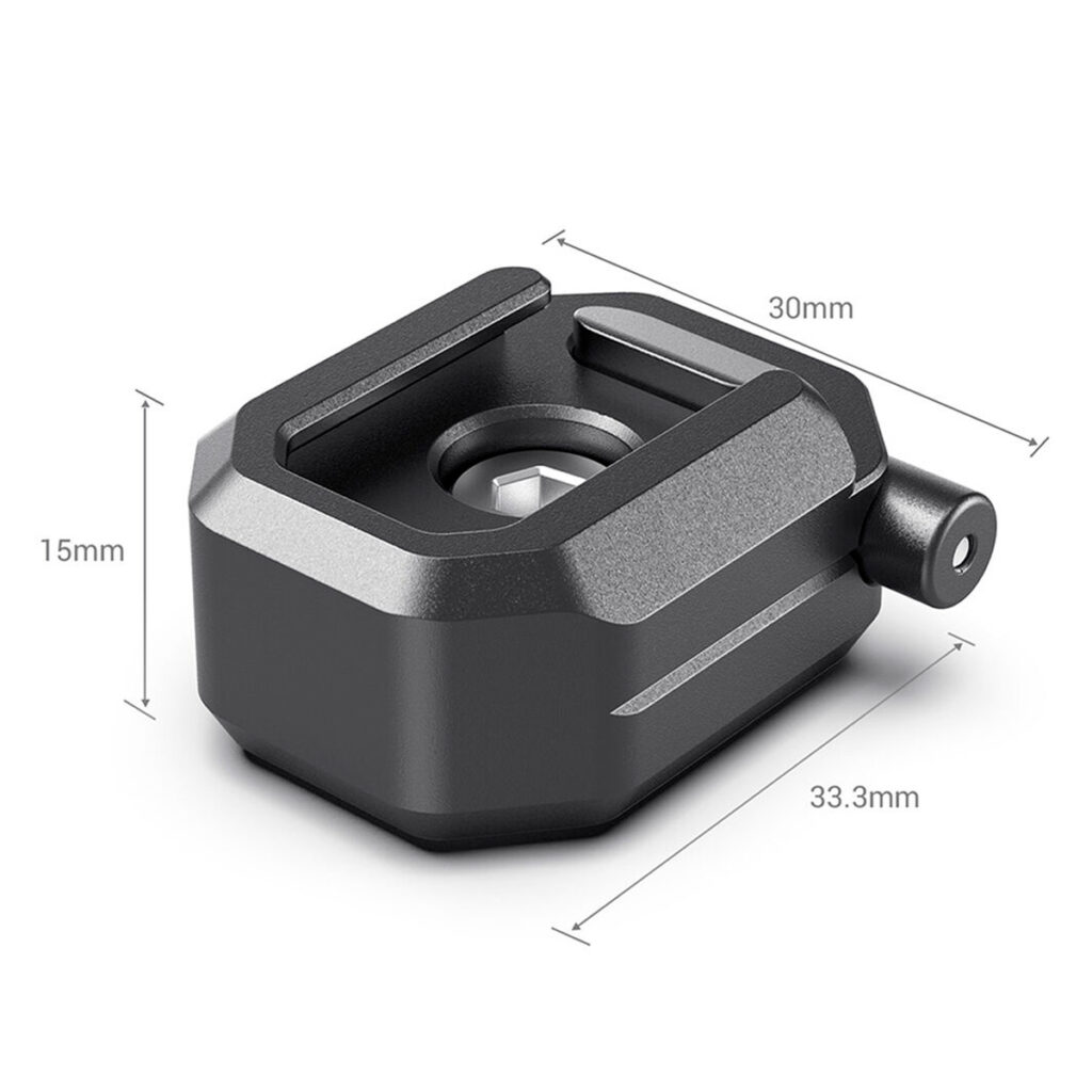 SmallRig-2797-3 SmallRig 2797 Multifunction Cold Shoe Mount w/ Safety Release on musta, suorakulmainen kameran lisävaruste (30mm x 15mm x 33,3mm), jossa on pyöristetyt reunat, keskellä oleva aukko ja sylinterinmuotoinen sivukiinnike.