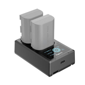 SmallRig-4084 The SmallRig 4084 battery charger for LP-E6 batteries features a stylish and compact design with two charging slots, a digital charge status display, two grey rechargeable batteries and a USB port on the front.