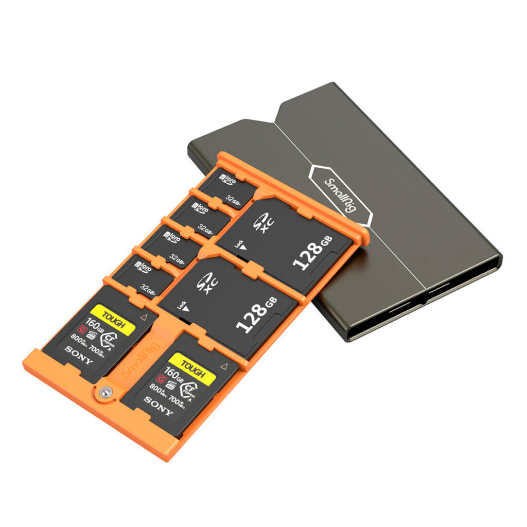 SmallRig-4107-2 The SmallRig 4107 memory card case for Sony CFexpress Type A memory cards is a compact black and silver case with an orange organizer compartment that holds six cards. Two memory card slots are visible on the side of the case.
