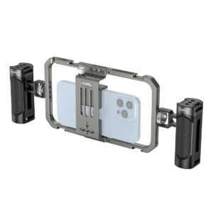 SmallRig-4121 The smartphone is attached to the silver SmallRig 4121 All-In-One Video Kit Mobile Basic with two side handles designed to stabilise and enhance mobile video shooting. The phone's camera lenses remain visible.