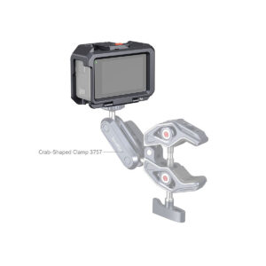 SmallRig_Cage_for_DJI_Osmo_Action_3_4119_008 The digital camera is attached to a mechanical arm, which is attached to the SmallRig 4119 Cage for DJI Osmo Action 3/4. The cage is adjustable and designed to hold the camera securely on different surfaces.