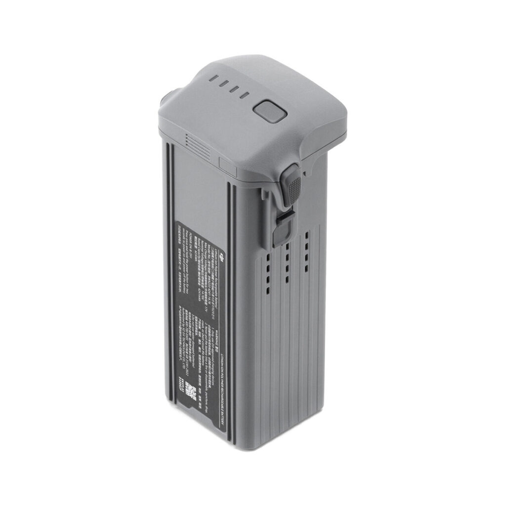 DJI Intelligent Flight Battery for Air 3 1 DJI Intelligent Flight Battery for Air 3 -akku on harmaa, suorakulmainen akku, jossa on tuuletusrakoja, sivusolki, valkoisella tekstillä varustettu etiketti ja neljä merkkivaloa päällä.