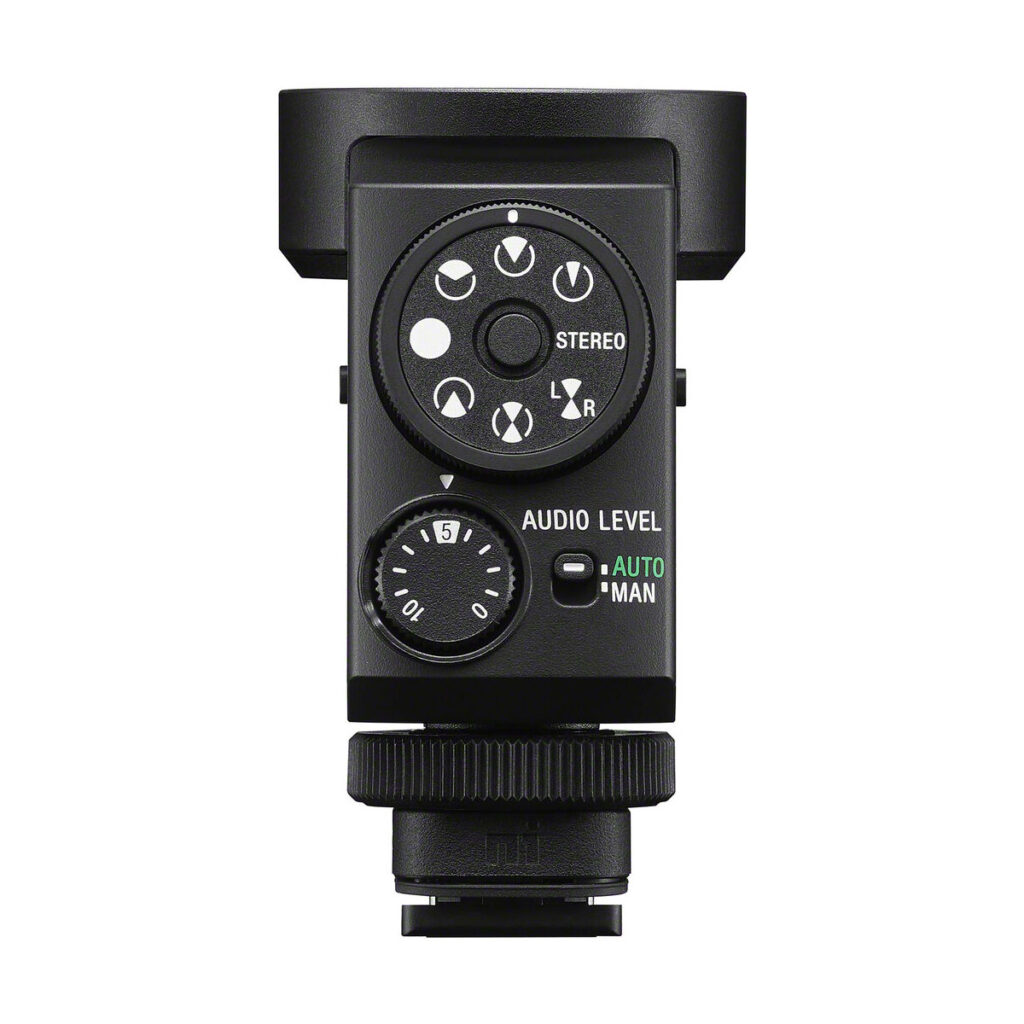 sony_ecm_m1_02 The Sony ECM-M1 microphone features dials, buttons, a stereo switch and a sound level section with automatic and manual modes. It has a hot shoe attachment on the bottom. The product is visible against a white background.