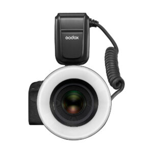 Godox_MF-R76_003 The black Godox MF-R76C TTL Macro Ring Flash - Canon is attached to the front of the camera lens, as seen from above. A circular flash surrounds the lens, and its power supply is connected by a twisted cable on top of it.