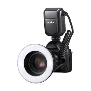 Godox_MF-R76_004 A digital camera equipped with a Godox MF-R76C TTL Macro Ring Flash for Canon and an external Godox AD300 Pro flash unit connected by a twisted pair cable is photographed against a white background.