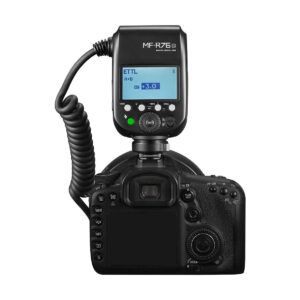 Godox_MF-R76_005 A digital DSLR camera with Godox AD300 Pro and Godox MF-R76C TTL Macro Ring Flash for Canon mounted on top; the flash shows the settings on the LCD screen and is connected with a twisted pair cable.