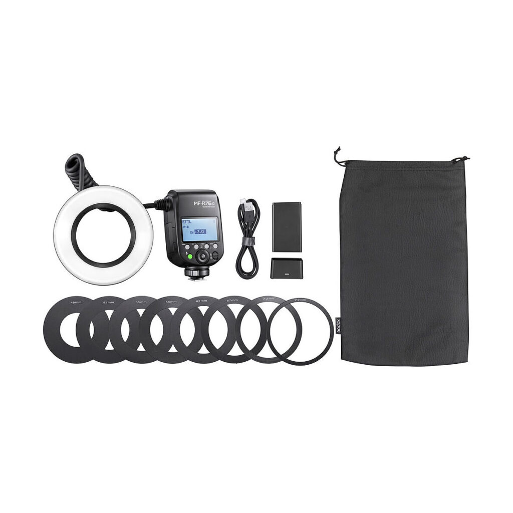 Godox_MF-R76_006 The Godox MF-R76C TTL Macro Ring Flash for Canon includes a control unit, flash ring, USB cable, two batteries, several lens adapter rings and a black drawstring bag - all shown on a white background.