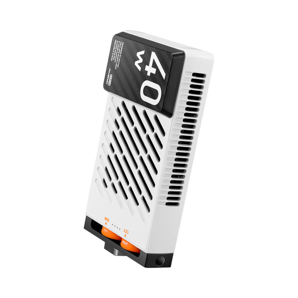 Zhiyun_Fiveray_M40_002 The Zhiyun Fiveray M40 Pocket Light is a white, rectangular device with black vents and a black top panel marked "40". It has orange and black switches and indicator lights near the bottom, visible against a white background.