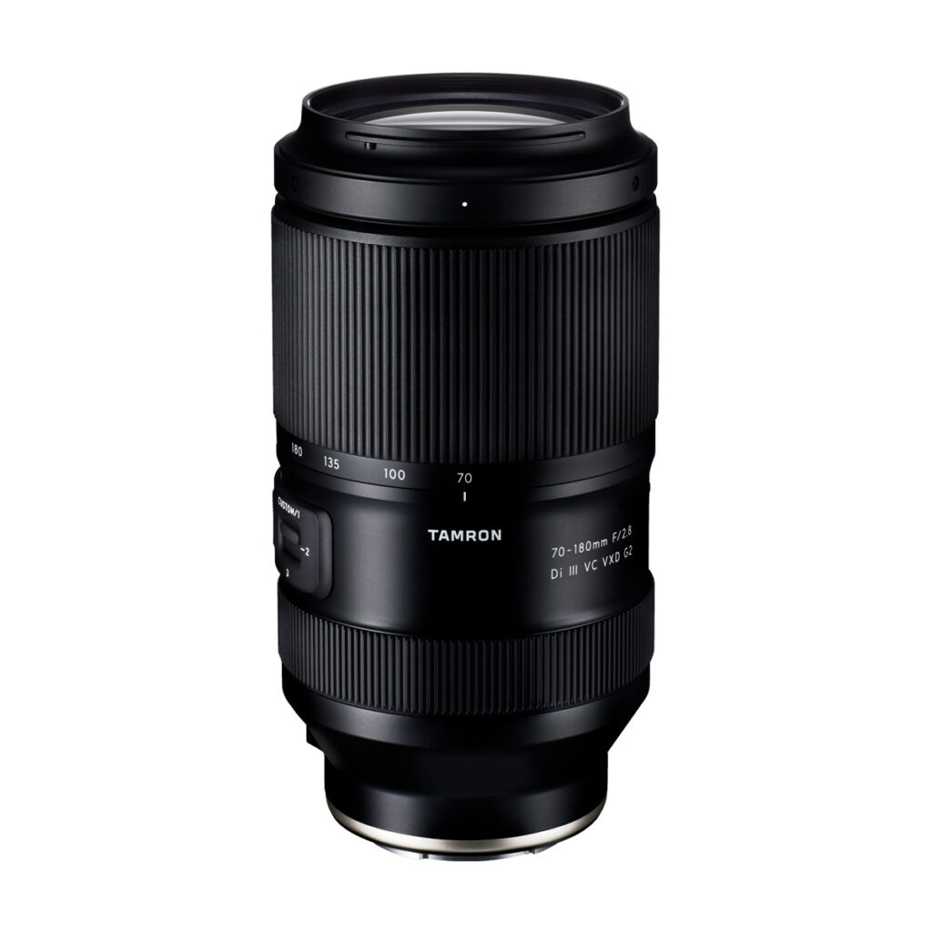 Tamron_17-50_f4_001 The Tamron 17-50mm F/4 Di III VXD lens for the Sony E is shown upright on a white background, with its zoom ring, focus ring and brand details highlighted.