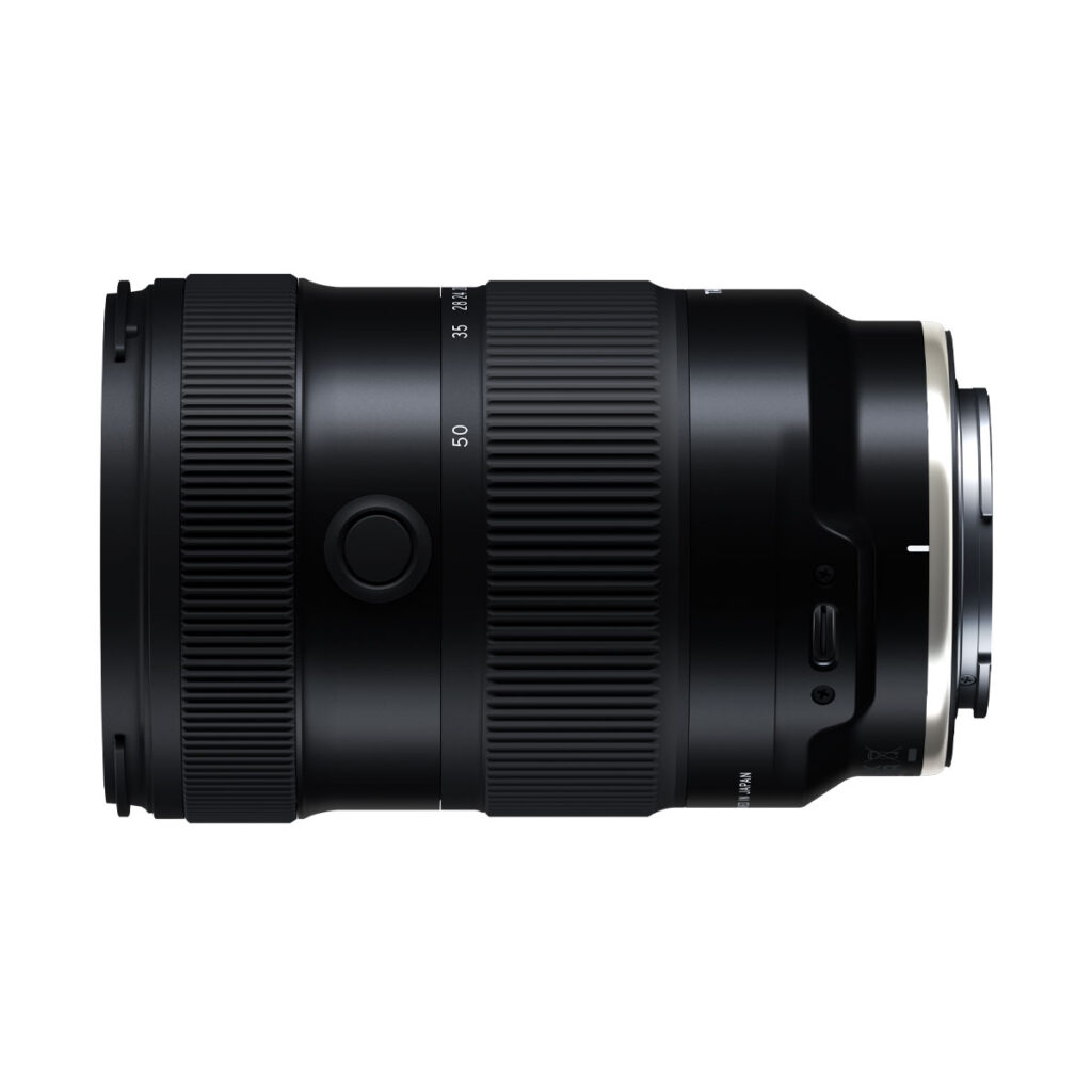 Tamron_17-50_f4_003 The Tamron 17-50mm F/4 Di III VXD lens for Sony E, shown in side profile against a white background, shows a black barrel with visible control rings, buttons and lens markings.