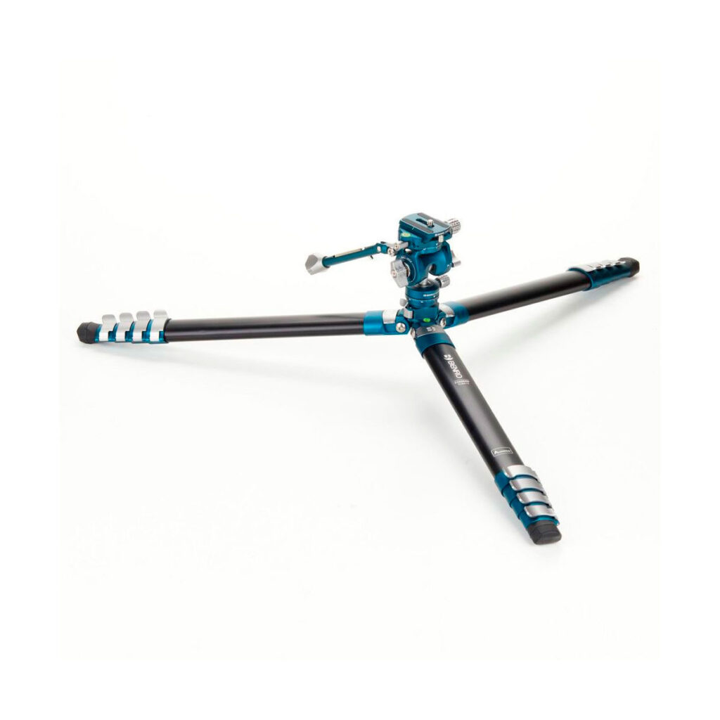 Benro_Cyanbirdalu_012 The Benro Cyanbird Aluminium Tripod + FS20PRO head, in black and blue, stands fully extended on a white surface with three wide feet, adjustable leg locks and a ball head mount.