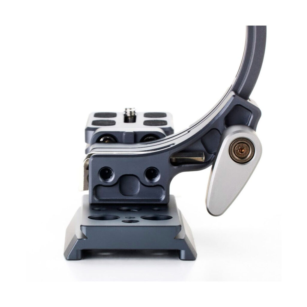 Benro_QRLB_002jpg A close-up of the front of the Benro Quick Rotation Lens Bracket, a metal camera mount featuring several holes and a lever for secure and adjustable mounting of the camera, against a white background.