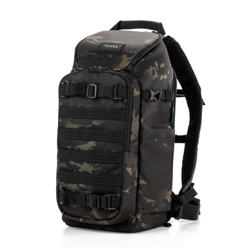 Tenba Axis V2 16L Backpack MultiCammusta camera backpack features a black and grey camouflage pattern, multiple zippered compartments, adjustable straps, side pockets and top handle. The backpack is pictured vertically on a white background.