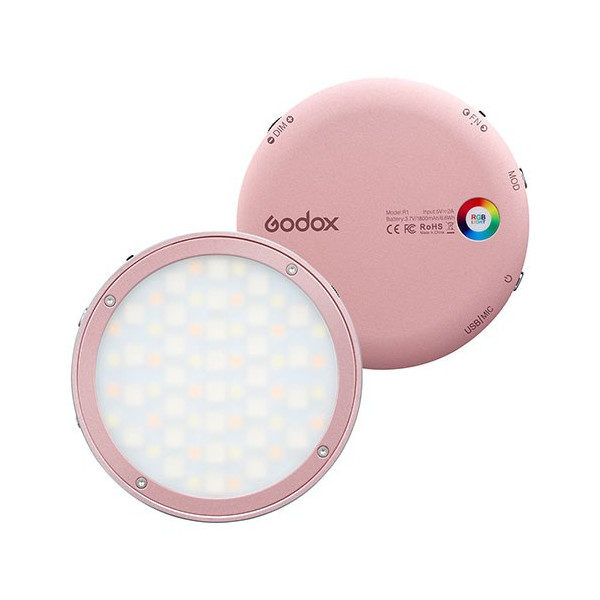1600763558_613 Kaksi pyöreää vaaleanpunaista Godox R1 Mobile RGB LED -valaisinta näytetään; toisessa näkyy sen valaistu LED-paneeli ja toisessa sen takaosa, jossa on ohjauspainikkeet ja värisäätöpyörä.
