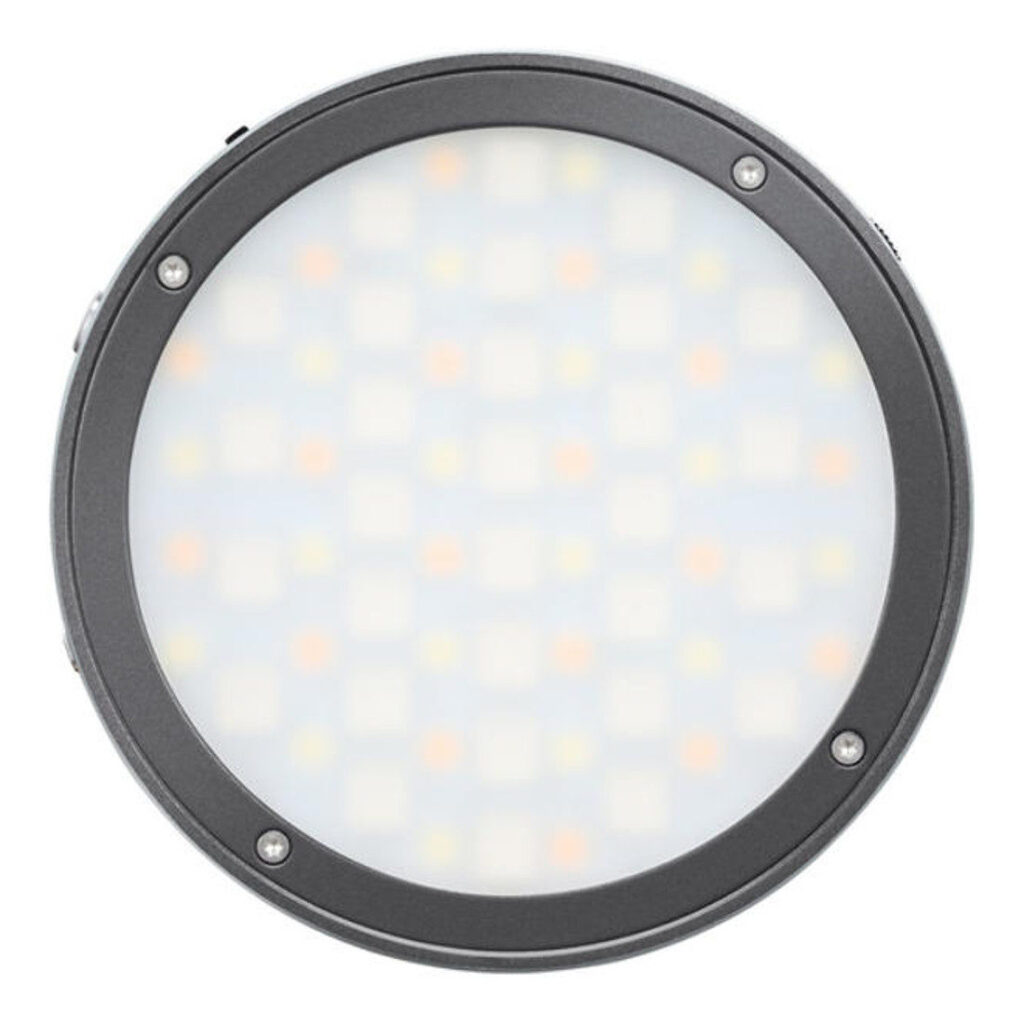 1600865319_239 Godox R1 Mobile RGB LED -valaisin - Harmaa sisältää pyöreän, himmeän paneelin mustassa kehyksessä, jossa on neljä näkyvää ruuvia, ylhäältä päin kuvattuna valkoisella pohjalla.