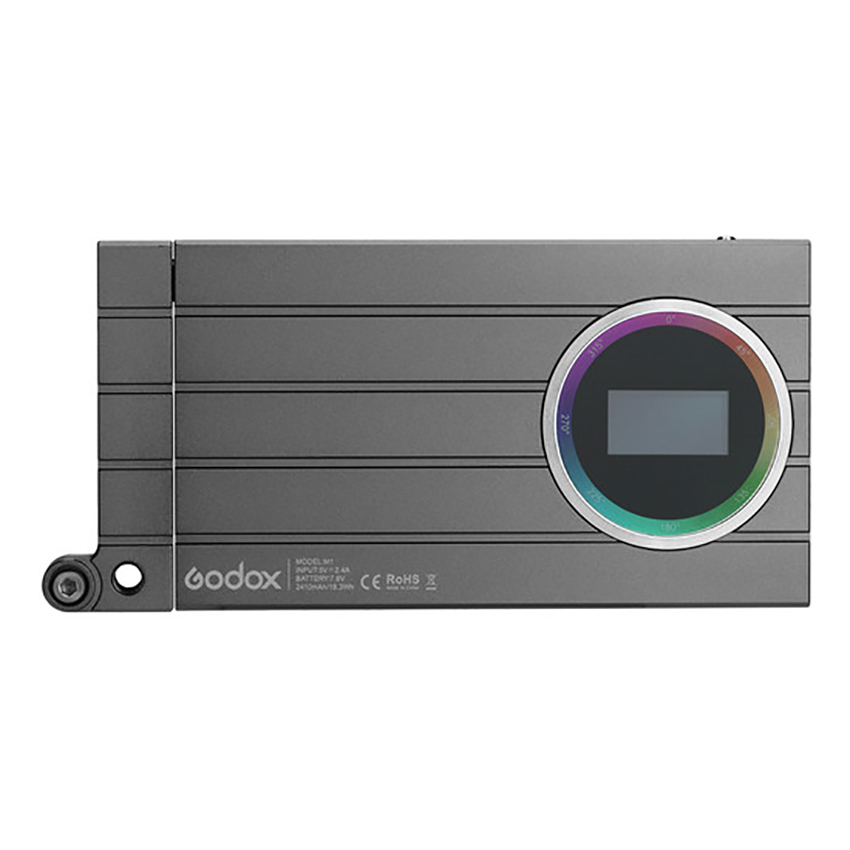 Godox M1 Mobile RGB LED-valaisin - Harmaa on suorakulmainen laite, jossa on metallinen viimeistely, vaakasuuntaiset urat, pyöreä monivärirengas ja pieni digitaalinen näyttö oikealla puolella.