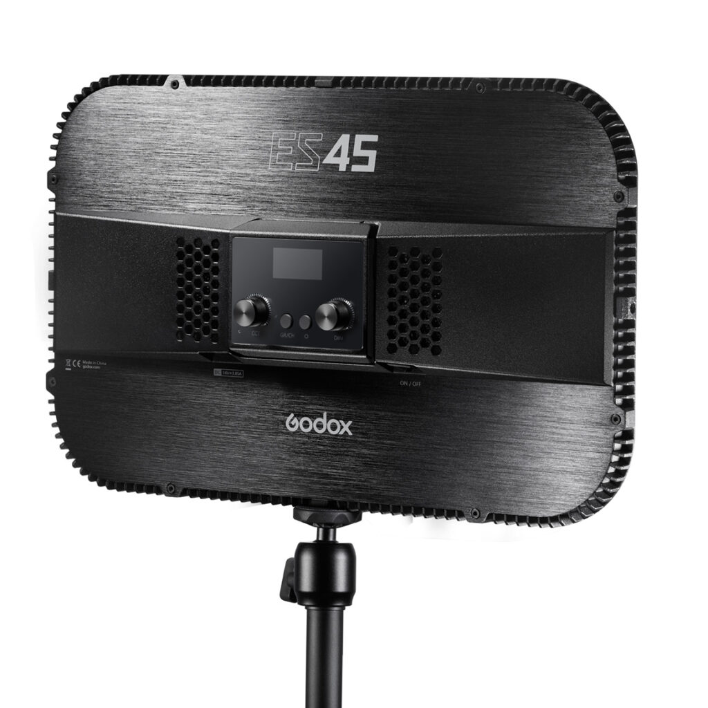 1612784140_877 The black Godox E-sports LED Light ES45 Kit is displayed from the rear on a stand with control knobs, a small screen and ventilation grilles, all in a sleek, modern design.