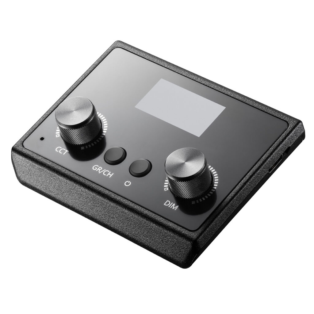 1612784141_080 The Godox E-sports LED Light ES45 Kit is a rectangular black device with two large switches (CCT and DIM), two smaller buttons (GR/CH and power symbol) and a small display on the top panel.