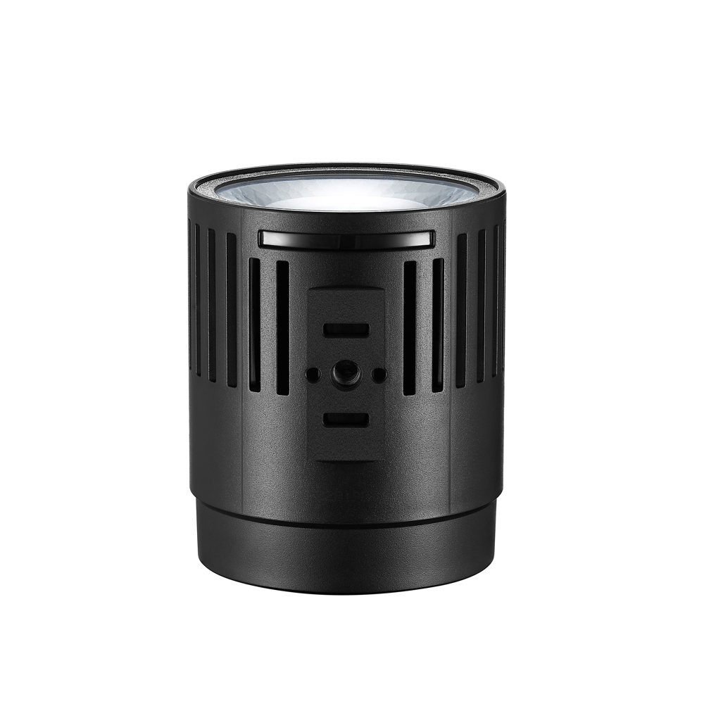 1660055369_817 Godox Litemons LED LC30Bi -pöytävideovalaisin on musta lieriömäinen elektroniikkalaite, jossa on pystysuuntaiset tuuletusaukot, ylälinssi ja etupuolella olevat painikkeet tai anturit, jotka näkyvät tavallisella valkoisella pohjalla.