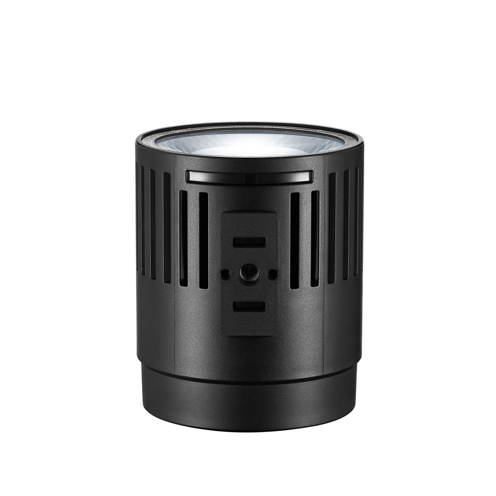 1660056755_853 Godox Litemons LED LC30D -pöytävideovalaisin on musta lieriön muotoinen laite, jossa on pystysuuntaiset tuuletusraot ja läpinäkyvä linssi yläosassa, kuvassa valkoista taustaa vasten.