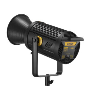 1660124410_966 Mustan ja keltaisen värinen Godox LED UL150 II Bi Silent Video Light -LED-valo, jossa on tuuletettu runko, on asennettu metallijalustalle valkoista taustaa vasten.