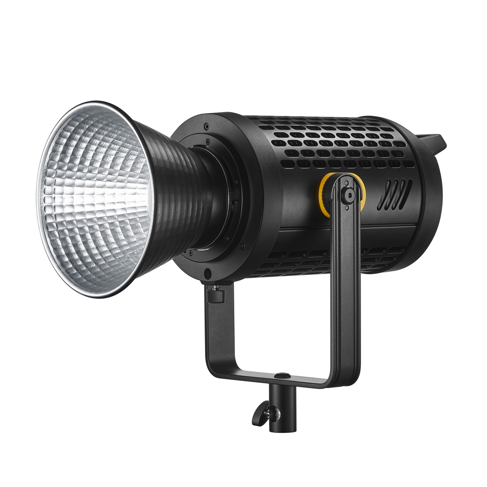 1660640441_144 Godox LED UL150II Silent -videovalaisimessa on musta sylinterimäinen runko, kuvioitu heijastin, keltainen säätönuppi ja tukeva kiinnike - ihanteellinen ammattimaiseen valokuvaukseen tai videovalaistukseen.