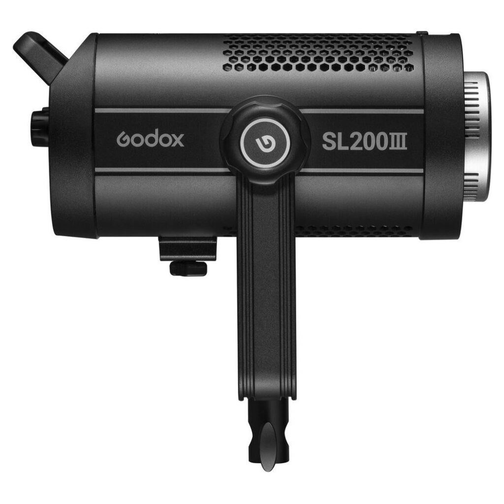 1675234812_851 Godox SL200III LED video light - LED light in black, side view, with cylindrical ventilated body, mounting bracket and control knobs.