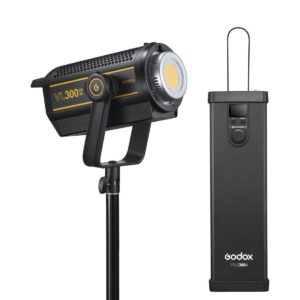 Musta Godox VL300II LED-videovalaisin -LED-valo, jossa on keltainen logo, on asennettu jalustalle sen suorakulmaisen tehonsäätöyksikön viereen, jossa on säätöpyörä ja näyttö.