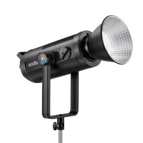 1683018528_789 The Godox SZ300R Zoom RGB LED video light is a professional black studio light with a large silver reflector mounted on a metal base and a side control knob with coloured accents.
