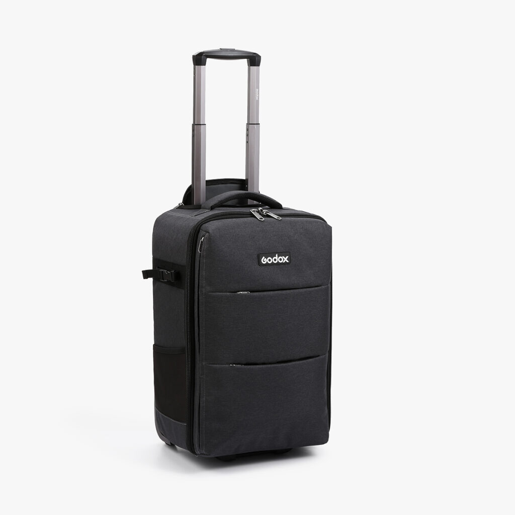 1586870954_603 The black Godox CB-17 Carry Roller Bag AD1200 Pro has a telescopic handle, two zippered front pockets and side handles.