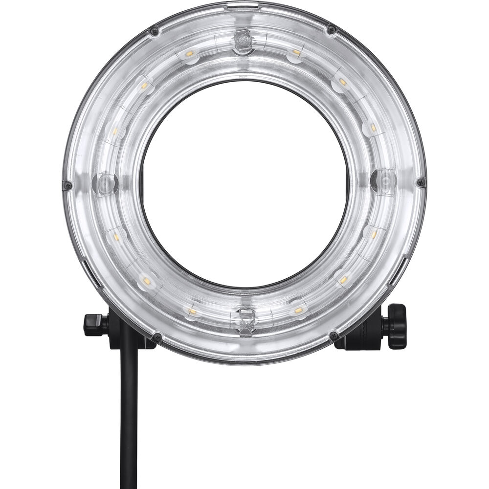 1656335601_328 Godox R200 Ring Flash Head for AD200Pro & AD200 -salamapää on esitetty edestäpäin mustalla jalustalla ilman valoa, jolloin sen kirkas ulkokotelo ja pienet yksittäiset LED-lamppujen lamput on sijoitettu pyöreän renkaan ympärille.
