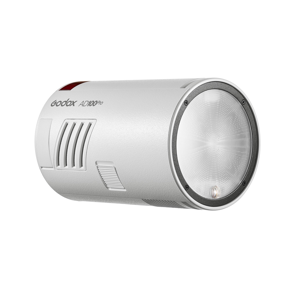 1669804233_717 Sylinterinmuotoinen harmaa Godox AD100 Pro TTL-stroboskooppivalaisin, jossa on kuvioitu sivu, tuuletusaukot ja suuri pyöreä salamalinssi eteenpäin.