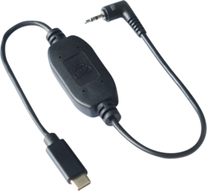 800q-01_122015 The ATOMOS USB-C Series Calibration and Control Cable is a black adapter with a USB-C connector, a 3.5mm audio jack in the right corner and a compact rectangular control box in the middle.
