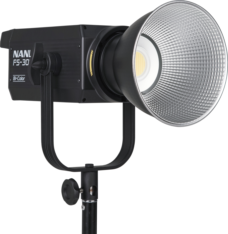 800q-02_119722 The NANLITE FS-300B LED Bi-color Spot Light is mounted on a black base with a large silver reflector and a bright central LED set against a white background.