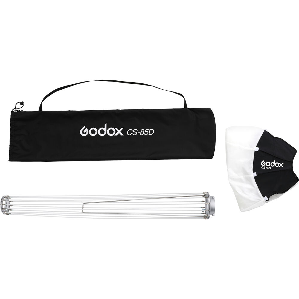 1599470176_113 Godox CS85D Lantern Softbox 85cm -pakkaus sisältää mustan kantolaukun, kokoontaitettavan metallikehyksen ja taitetun valkoisen ja mustan kangasdiffuusorin, kaikki valkoisella pohjalla.