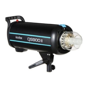 1603173356_895 The Godox QS800II is a black studio strobe light featuring a cylindrical flash tube, blue accents, a handle and an adjustable bracket.