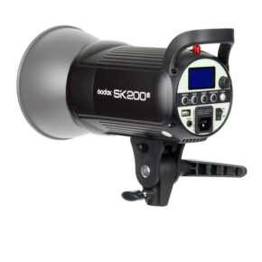 1603176897_389 The Godox SK200II is a black studio flash unit featuring a silver reflector, a control panel, an LCD screen and a handle, designed for professional photography.