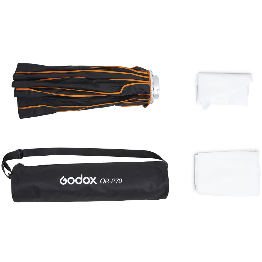 1627566152_877 Taitettu Godox Quick Release Parabolic Softbox QR P70 Bowens oransseilla korostuksilla, merkitty musta kantolaukku ja kaksi valkoista diffuusoria ovat esillä valkoisella pohjalla.