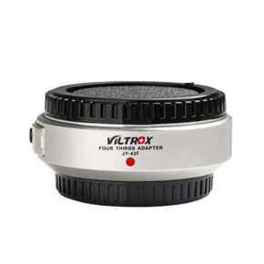1632488304_334 The Viltrox JY 43 - MFT Autofocus Adapter (silver) features black brushed edges and a red dot indicator, allowing you to attach camera lenses to Four Thirds camera bodies.