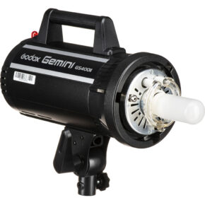 1637156863_296 The Godox GS400II is a studio flash unit featuring a cylindrical flash tube and a top handle, designed for professional photographic lighting.