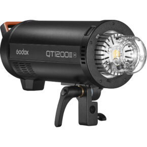 1643029962_350 The Godox QT1200IIIM is a black studio flash with a cylindrical design, mounted on a swivel mount, with a clear glass flash tube and reflector on the front.