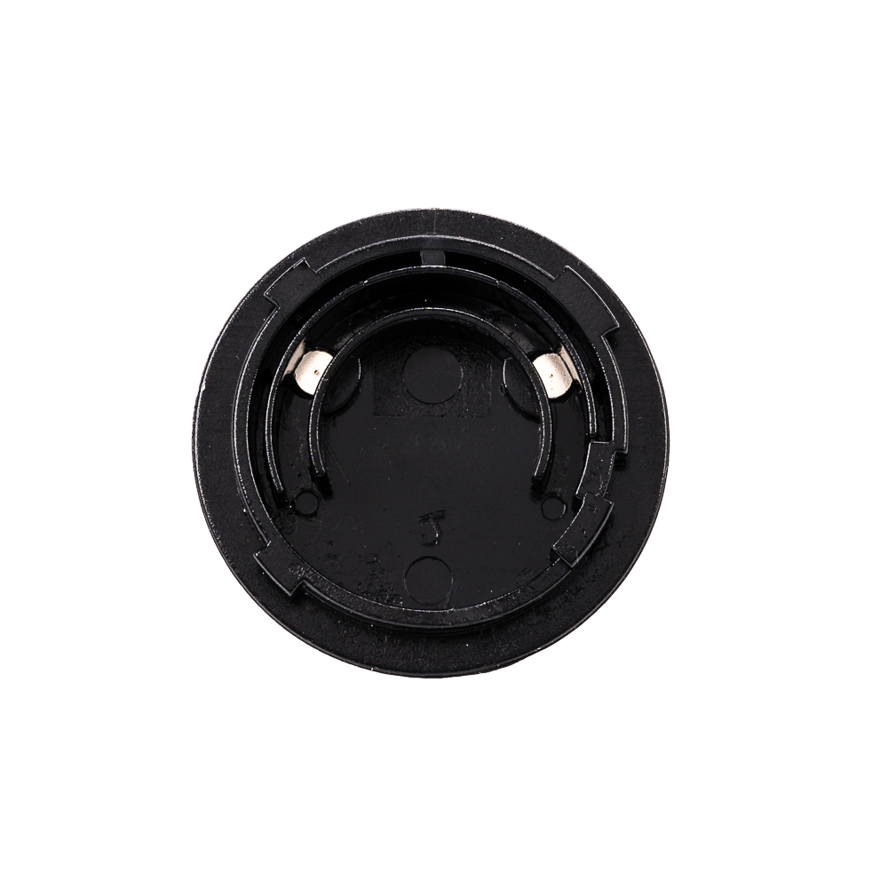 1657637765_455 Lähikuva Viltrox AC Adapter VL400T / VL600T:n pyöreästä, mustasta muovisesta paristotelineestä, joka on rakennettu kolikkoparistolle ja jossa on kaksi sisäistä metallikosketinta sähköliitäntää varten.